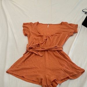 NWOT - just tried on once. Orange adorable romper by free people